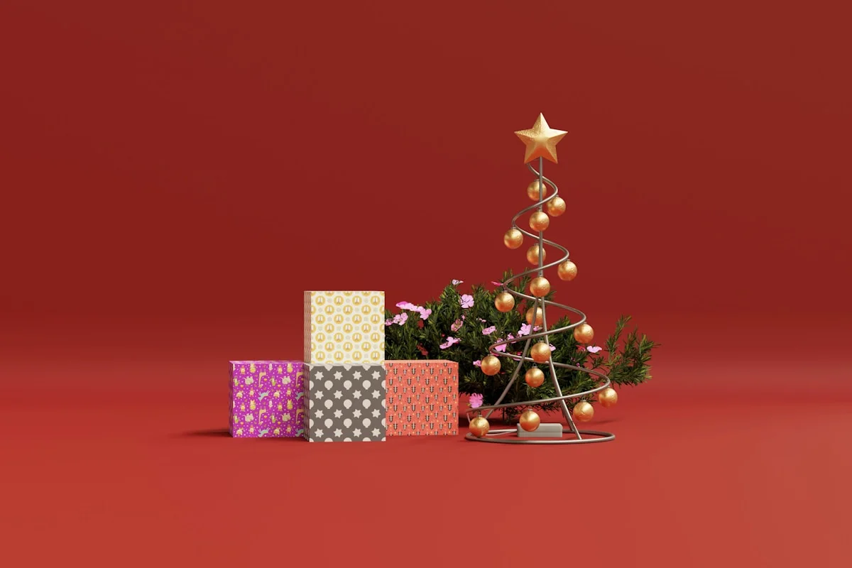 a small christmas tree surrounded by presents on a red background